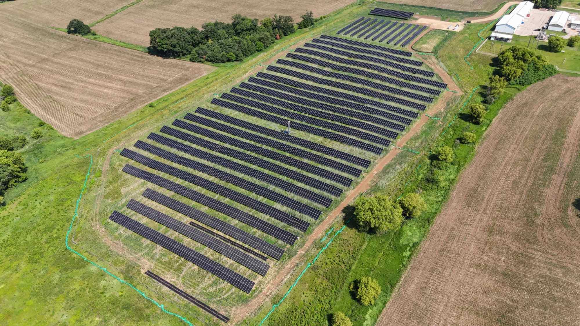 Aerial view of full UW Kegonsa Solar Array surrounded by farmland and research buildings