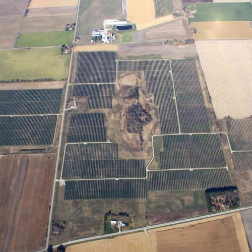 Aerial view of the Beaver Dam Solar Project showing large utility scale panel fields across the site in Beaver Dam Wisconsin.