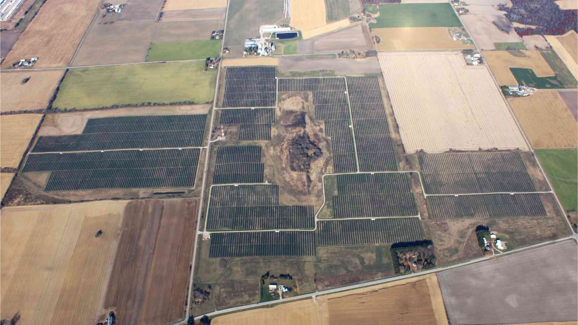 Aerial view of the Beaver Dam Solar Project showing large utility scale panel fields across the site in Beaver Dam Wisconsin.